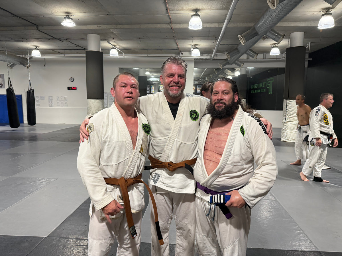 Josh Willis in his brown belt with close friends Levii and James
