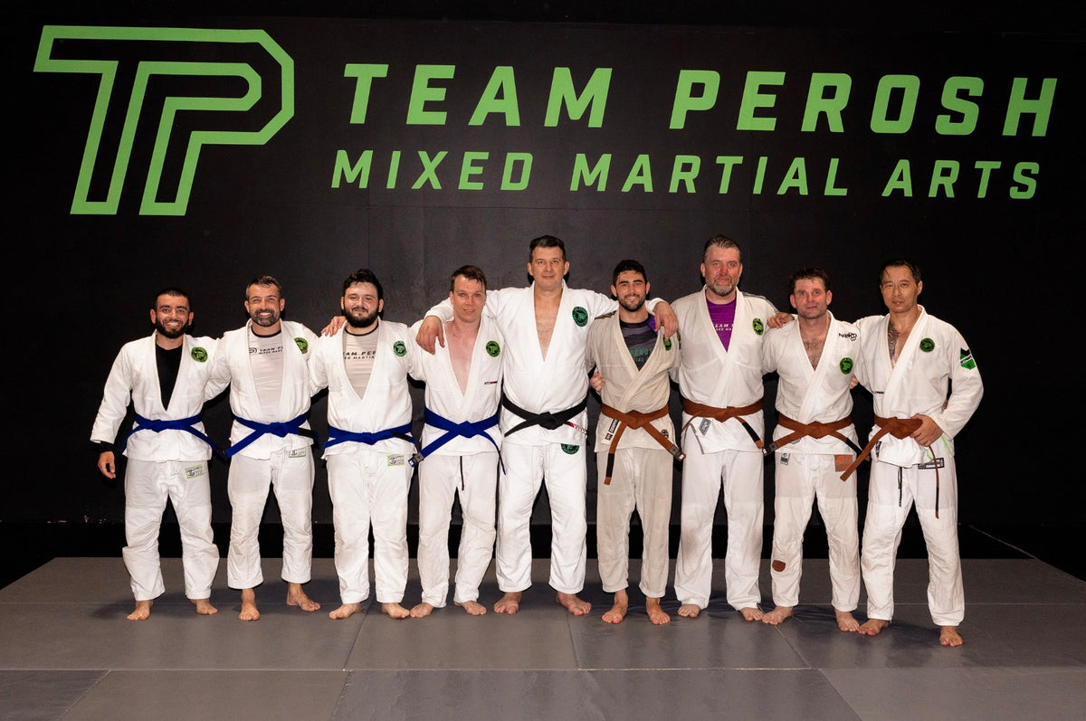 Team Perosh Mixed Martial Arts belt promotions, December 2025, including Josh Willis receiving his brown belt