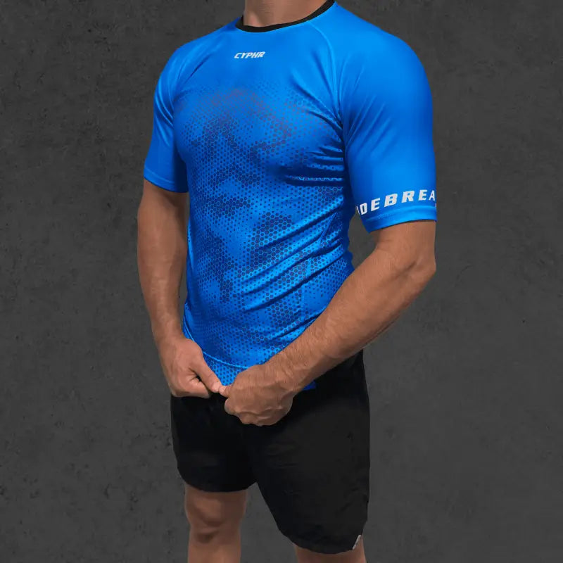 Bright blue Cyphr Combat Rash Guard featuring hexagon camouflage and Debrek text on sleeve